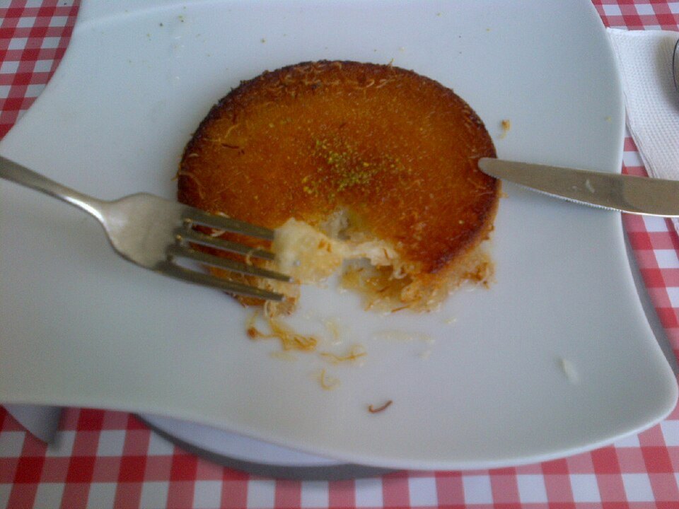 Künefe — shredded pastry over melting cheese, soaked in syrup.